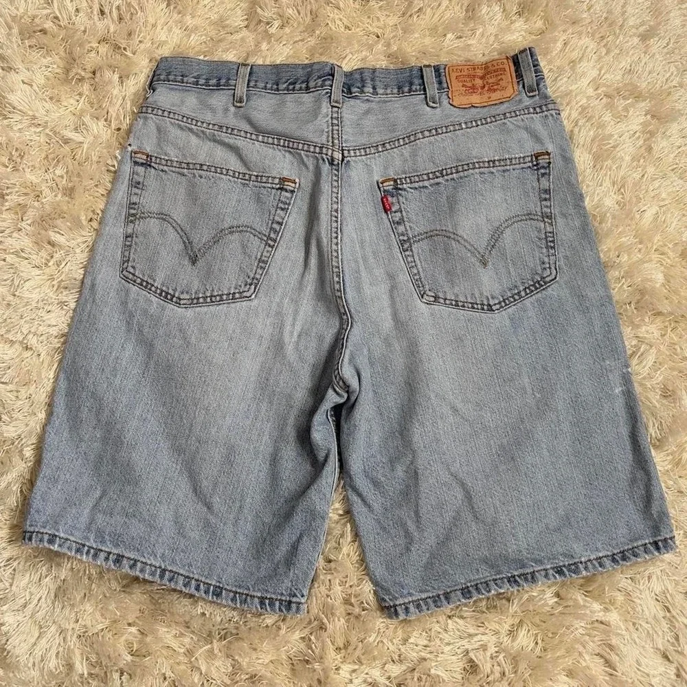 Vintage Levi's 550 Denim Jorts Light Wash Relaxed Fit Black Bat Wing Size 38W